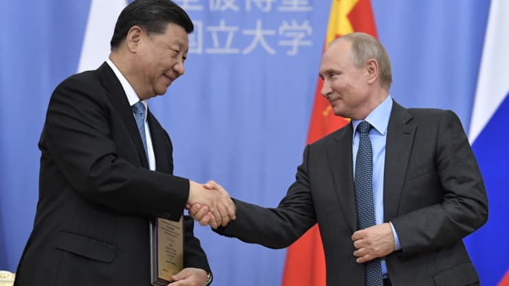 ST PETERSBURG, RUSSIA - JUNE 6, 2019: China’s Persident Xi Jinping (L) and Russia’s President Vladimir Putin shake hands at a ceremony at St Petersburg University in which Xi Jinping was awarded St Petersburg University honorary doctoral degree.