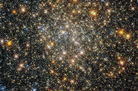 Hubble peered by strategy of mud and gas to consume this heavenly globular cluster
