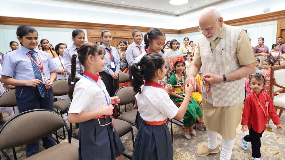 Glance: Indian PM Modi celebrates Rakshabandhan with young college young folks