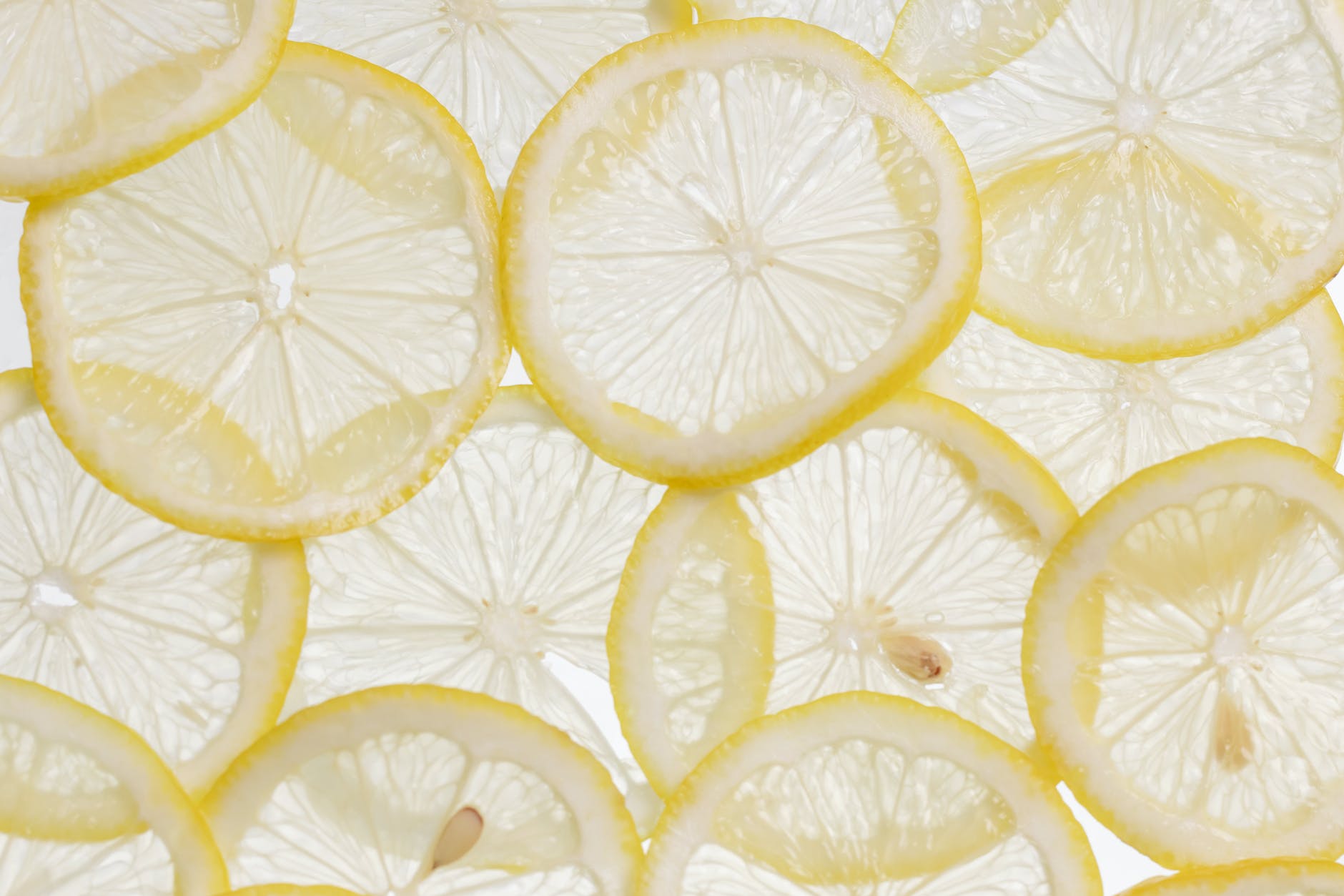 yellow lemon fruits on white metal rack